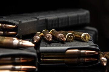 Sharp rifle bullets on black background