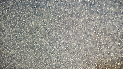 pattern of gray and white circles, structural, different sizes, gray, white colors, sunlit, daytime, structure, background, macro, foam plastic, original, close-up, bright, horizontal photo, vertical
