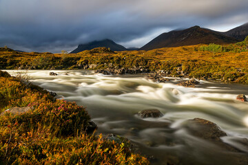 River valley in autumn. Autumn river valley. River stream on mountain valley in autumn. Mountain river valley in autumn