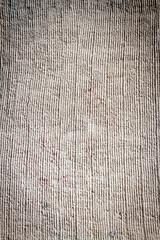 Gray lined stucco street wall texture background. Architectural detail.