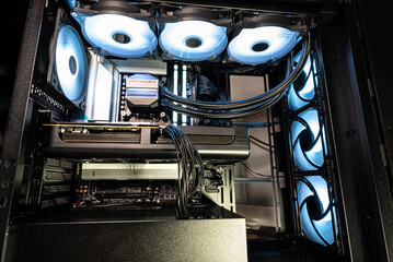 The inside of a modern computer assembled in 2025, showing DDR5 memory and other components.