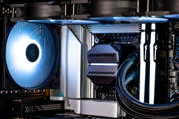 The inside of a modern computer assembled in 2025, showing DDR5 memory and other components.