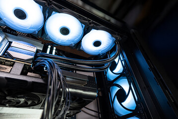 The inside of a modern computer assembled in 2025, showing DDR5 memory and other components.