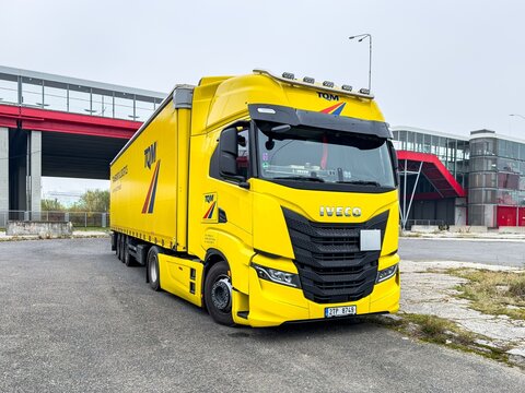 Yellow Iveco S-Way semi-trailer truck car of Czech TQM transportation company