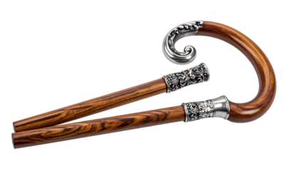 Two elegant wooden canes with ornate silver detailing, isolated on black