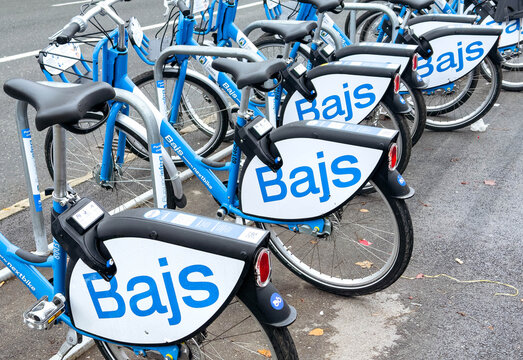 Zagreb, Croatia - December 14, 2025: Bajs bike-sharing program bicycles lined up in urban setting, showcasing modern transportation options with vibrant blue and white design