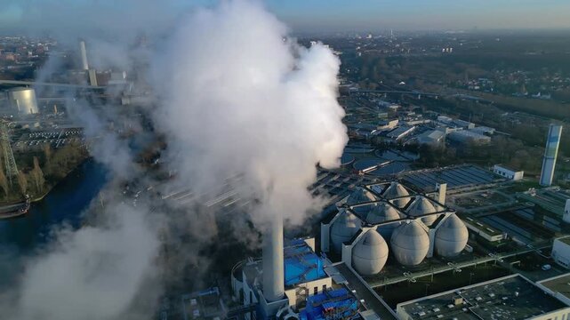 sewage treatment plant Industrial emitting smoke. Dramatic aerial view drone