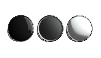 Three round, metallic buttons or discs in varying shades of black and white