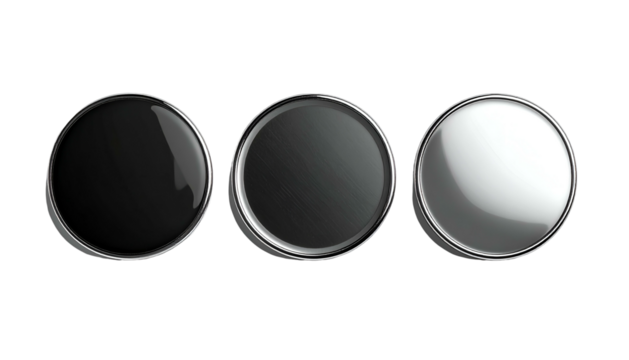 Three round, metallic buttons or discs in varying shades of black and white - Powered by Adobe