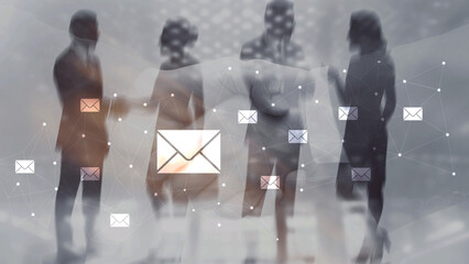 Businesswomen communicating through digital email network in modern office