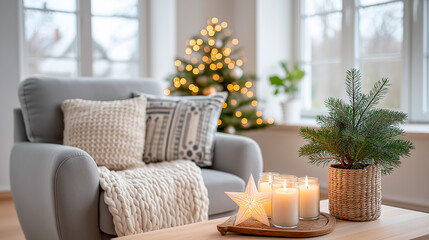 Christmas living room with small tree in neutral tones and candles on the table displaying holiday decor and cozy atmosphere