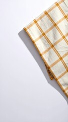Off-white plaid fabric lies on white backdrop, angled