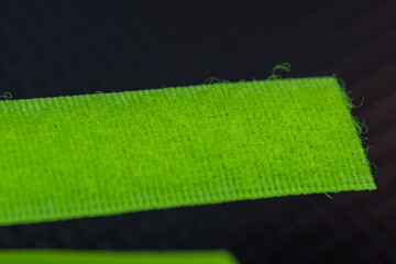 green  blue a Velcro-type fastener (also known as a hook-and-loop fastener). This is a macro view showing how the two parts snap together