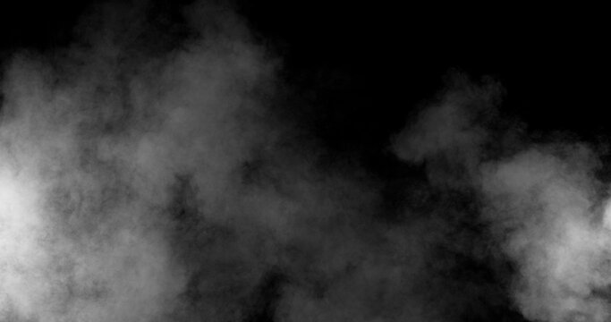 Realistic smoke effect drifting and spreading in freeze motion against a black background. Cinematic atmospheric fog ideal for VFX compositing, overlays, transitions, and moody visual effects.