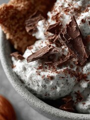 Delicious dessert bowl with creamy chocolate topping and crunchy garnish