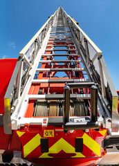 Firefighting equipment in focus: ladder system, cable drum, safety fittings and mechanical details in precise view