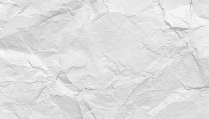 Crumpled white paper surface with creases and folds functioning as a background for text and layout design