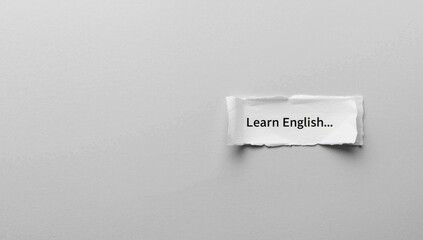 Fragmented paper with gray background featuring a visual symbol for learning English, used as an educational background