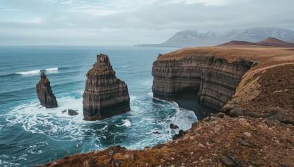 Dark basalt rocks forming a dramatic coastline in Iceland, ideal for environmental or geological themes