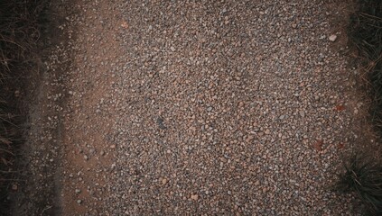 Aerial view of gravel pathway texture, used for UI backdrop or editorial headers, Earth Day