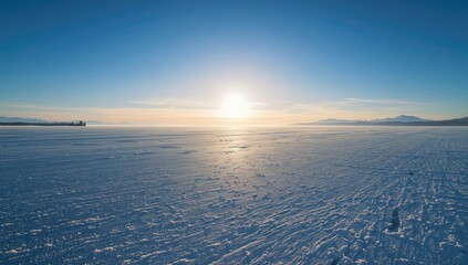 Frozen lake scene with icy surface and surrounding snow, highlighting climate change impacts on natural ecosystems
