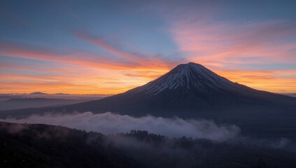 Cloud-covered mountain range during sunrise, highlighting weather patterns
