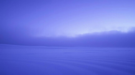 Obraz premium Vast blue expanse of snow under a hazy sky