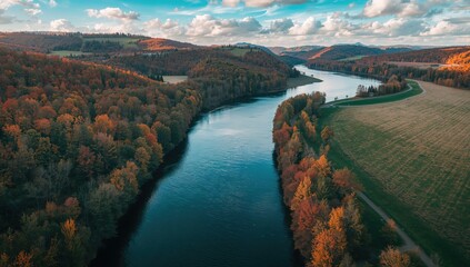 Bird's-eye view of the Isar River at Sylvenstein Dam tributary in autumn, emphasizing seasonal landscape changes