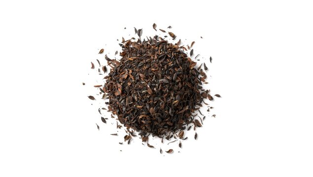 High-angle view of CTC tea leaves arranged on white surface for product catalog, focusing on leaf texture