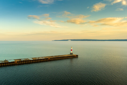 Sunrise Over Pier and Lighthouse in Petoskey with Copy-Space