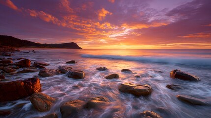 Dramatic Sunset Over Rocky Coastline With Crashing Waves.