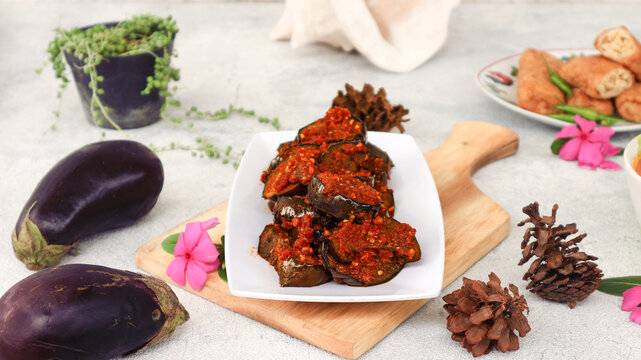 Sambal terong, also known as terong balado, is a beloved Indonesian side dish of stir-fried eggplant smothered in fiery chili paste. This spicy delicacy is a staple in local households and diners,