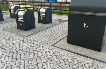 Modern garbage cans designed for separate collection of garbage in urban parks