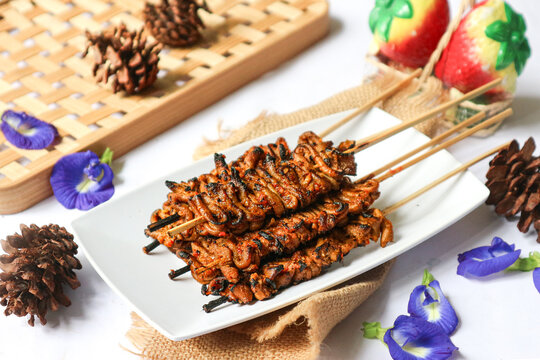 Sate usus, an Indonesian satay made from chicken intestines, is marinated in spicy sauce and charcoal-grilled to deliver a smoky, savory flavor.