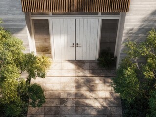 Modern home entrance double doors, stone path, greenery, and wood awning