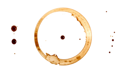 Brown coffee ring stain with multiple drips scattered on a stark black background