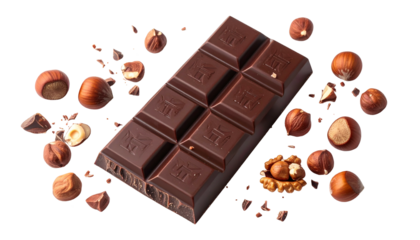 A dark chocolate bar with hazelnuts arranged artistically on a black background
