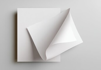 Stack of white sheets with one top sheet curling up at the corner