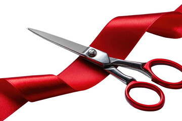 Sharp scissors cutting a red ribbon