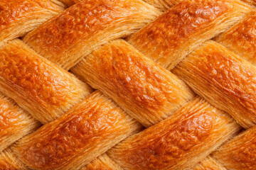 デニッシュ生地の編み込み焼き面のマクロ質感背景