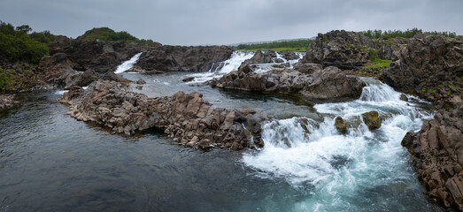 drone panorama of the idyllic Glanni Waterfall in West Iceland