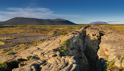 panorama view of the fault line of the rift valley of the Mid-Atlantic Ridge at the Grjotagja Caves near Myvatn Lake in Icleand © makasana photo