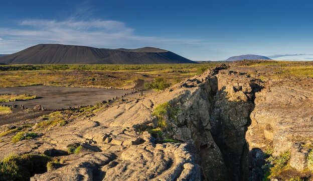 panorama view of the fault line of the rift valley of the Mid-Atlantic Ridge at the Grjotagja Caves near Myvatn Lake in Icleand