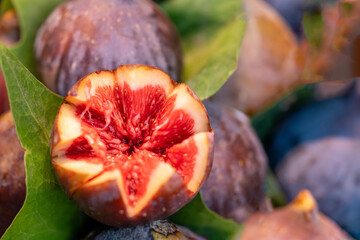 Close-up of a fresh ripe fig artistically cut open at a traditional food market