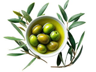 Fresh olives in a small white bowl, bathed in olive oil, surrounded by olive leaves