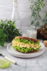 A sandwich served with egg salad