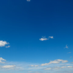 Bright blue sky with white clouds.
