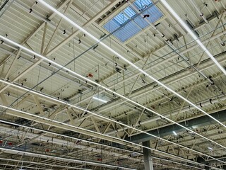 Warehouse Illuminated With Energyefficient Lights, Industrial Facilities Equipped With Large...