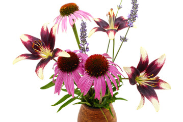 Beautiful summer bouquet of lilies echinacea and lavender in a vase.
