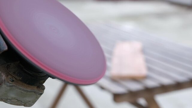 sander polishing wood with high pitched sound. Power tool used to smooth surfaces by abrasion with sandpaper